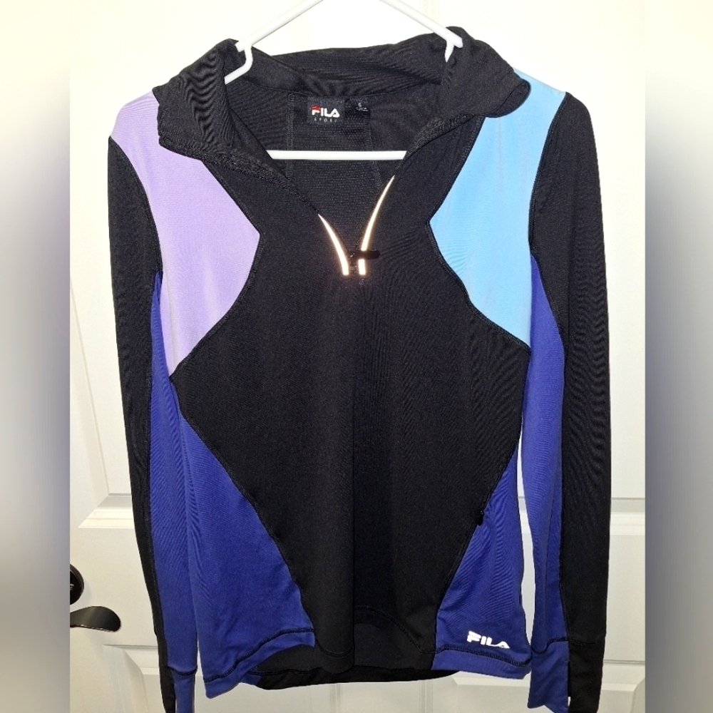A Fila Sport Running Jacket In A Color Block Pattern In A Ladies Size Small.